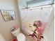 Bathroom featuring a toilet and shower with butterfly curtain art at 6481 W Treeline Ln, McCordsville, IN 46055