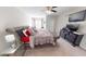 Luxurious bedroom with a large bed, stylish decor, ceiling fan and a flat screen TV at 6481 W Treeline Ln, McCordsville, IN 46055