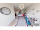 Stylish bedroom with comfortable seating and a ceiling fan at 6481 W Treeline Ln, McCordsville, IN 46055