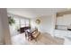 Inviting dining area featuring hardwood floors, a wooden dining table and a view of the kitchen at 6481 W Treeline Ln, McCordsville, IN 46055