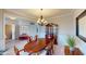 Cozy dining room with classic furniture, wood floors, and decorative wall accents at 6481 W Treeline Ln, McCordsville, IN 46055