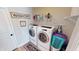 Laundry room featuring a washer, dryer and laundry basket at 6481 W Treeline Ln, McCordsville, IN 46055