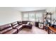 Cozy living room features a comfortable sectional sofa and natural light from the window at 6481 W Treeline Ln, McCordsville, IN 46055