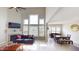 Bright living room boasts high ceilings, fireplace, large windows, and an adjacent dining area at 6481 W Treeline Ln, McCordsville, IN 46055