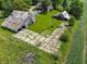 Aerial view of a farmhouse with two barns and a field of corn at 695 N 650 W, Lebanon, IN 46052