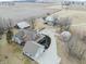 Expansive aerial view of a charming home with barns, outbuildings, and a long driveway surrounded by plowed farmland at 695 N 650 W, Lebanon, IN 46052