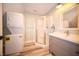 Bathroom featuring washer/dryer combination, modern vanity, and walk-in shower at 695 N 650 W, Lebanon, IN 46052