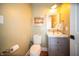 Neutral powder room featuring a gray vanity, stylish fixtures, and an elegant framed painting at 695 N 650 W, Lebanon, IN 46052