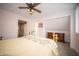 Bedroom with plush carpeting, a wooden dresser, and a gold metal bed frame with decorative headboard at 695 N 650 W, Lebanon, IN 46052
