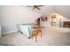 Spacious carpeted bonus room with a fan, sloped ceilings, and comfortable seating at 695 N 650 W, Lebanon, IN 46052