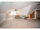 Carpeted bonus room featuring natural light, sloped ceilings, and comfortable seating at 695 N 650 W, Lebanon, IN 46052
