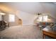 Bright and airy carpeted bonus room featuring natural light and ceiling fan at 695 N 650 W, Lebanon, IN 46052
