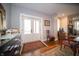 Welcoming entryway with hardwood floors, a front door with glass inserts, and elegant decor at 695 N 650 W, Lebanon, IN 46052