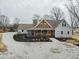 Charming home with a welcoming yellow door, inviting front porch, and landscaped garden at 695 N 650 W, Lebanon, IN 46052