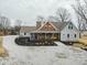 Charming home with a welcoming yellow door, inviting front porch, and landscaped garden at 695 N 650 W, Lebanon, IN 46052