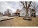 A beautiful country-style home with a large tree in the front yard and gravel driveway at 695 N 650 W, Lebanon, IN 46052