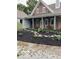 Home featuring brick and siding exterior, complemented by manicured landscaping and a winding stone path at 695 N 650 W, Lebanon, IN 46052