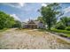 Charming home with a mix of brick and siding, a cozy front porch and surrounded by lush greenery and landscaping at 695 N 650 W, Lebanon, IN 46052