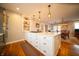 Open concept kitchen with a central island, built-in appliances, and hardwood floors throughout at 695 N 650 W, Lebanon, IN 46052