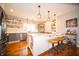 Gourmet kitchen featuring a large island with seating, stainless steel appliances, and open shelving at 695 N 650 W, Lebanon, IN 46052