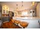 Open kitchen with a spacious island, pendant lighting, stainless steel appliances, and ample cabinet space at 695 N 650 W, Lebanon, IN 46052