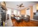 Comfortable living room with exposed brick wall, hardwood floors, and a decorative fireplace at 695 N 650 W, Lebanon, IN 46052