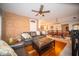 Open-concept living and dining area featuring hardwood floors, exposed brick, and modern lighting at 695 N 650 W, Lebanon, IN 46052