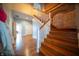 Wooden staircase with brick wall and hardwood floors at 695 N 650 W, Lebanon, IN 46052