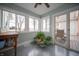 Bright sunroom with a wall of windows and sliding door to the deck at 695 N 650 W, Lebanon, IN 46052