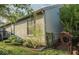 Green backyard featuring an irrigation hose on the fence and the home's neutral siding at 7013 Ringtail Ct, Indianapolis, IN 46254