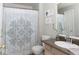 Well-maintained bathroom featuring a shower with a decorative curtain, and a granite-topped vanity at 7013 Ringtail Ct, Indianapolis, IN 46254