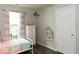 Comfortable bedroom boasting light walls, wood floors, natural light, and whimsical accents at 7013 Ringtail Ct, Indianapolis, IN 46254