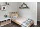 Cozy bedroom with a wooden bed frame, mountain-themed decor, and ample storage space at 7013 Ringtail Ct, Indianapolis, IN 46254