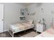 Charming bedroom with a white metal bed frame, colorful bedding, and stylish decorations at 7013 Ringtail Ct, Indianapolis, IN 46254