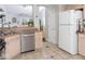 Well-lit kitchen featuring stainless steel appliances, tile floors, and an open layout design at 7013 Ringtail Ct, Indianapolis, IN 46254