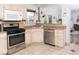 Well-equipped kitchen with stainless steel appliances and plenty of cabinet space at 7013 Ringtail Ct, Indianapolis, IN 46254