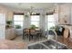 Bright eat-in kitchen boasting stainless steel appliances, tile floors, and natural light from large windows at 7013 Ringtail Ct, Indianapolis, IN 46254