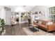 Open-concept living space with wood floors and seamless access to the kitchen at 7013 Ringtail Ct, Indianapolis, IN 46254