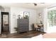 Bedroom with a workspace, wood floors, modern decor, and a view of another bedroom at 7013 Ringtail Ct, Indianapolis, IN 46254