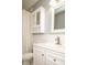 A bathroom featuring white fixtures and a white vanity with a marble top at 7136 Allegan Dr, Indianapolis, IN 46217