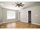 Large bedroom featuring a ceiling fan, wood floors, and natural light at 7136 Allegan Dr, Indianapolis, IN 46217