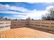 Spacious wooden deck with decorative white railing offers an inviting outdoor living space at 7136 Allegan Dr, Indianapolis, IN 46217