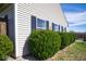 Exterior view of the home highlights well-maintained landscaping and a tidy, classic design at 7136 Allegan Dr, Indianapolis, IN 46217
