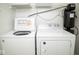 A laundry room with a washer, dryer, and water filter at 7136 Allegan Dr, Indianapolis, IN 46217