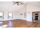 Bright living room with high ceilings, hardwood floors, and an open view to the kitchen at 7136 Allegan Dr, Indianapolis, IN 46217