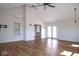 Open living room with hardwood floors, high ceilings, and natural light from a double door at 7136 Allegan Dr, Indianapolis, IN 46217
