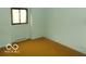 Empty bedroom with bright natural light from the window at 7240 W Glendale Ln, Greenfield, IN 46140