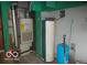 A utility room featuring a water heater and a furnace, essential for home comfort and maintenance at 7240 W Glendale Ln, Greenfield, IN 46140