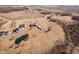 Wide aerial view showcasing multiple large properties, pond, outbuilding and wooded areas at 7260 N 225 W, Lebanon, IN 46052