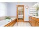 Bathroom with a tub, a view of the main bedroom, and wooden cabinets at 7260 N 225 W, Lebanon, IN 46052